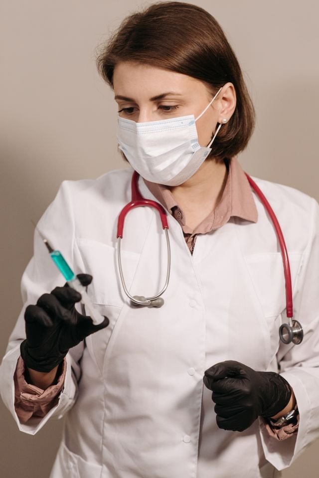 doctor with shot needle