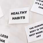 Sticky notes with health slogans, e.g., 'Healthy Habits' and 'Eat less sugar'.